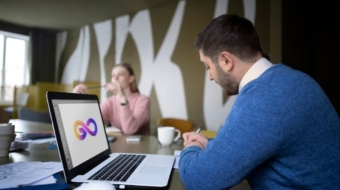 medium-shot-people-working-with-laptop_23-2149345218