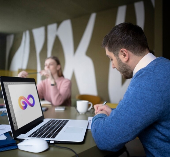 medium-shot-people-working-with-laptop_23-2149345218